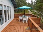 The front deck holds the table with an umbrellaseating for 6.